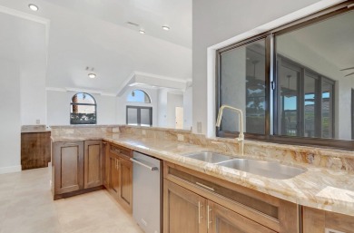 Nestled in the heart of Boca Woods Country Club, this home sits on Boca Woods Country Club in Florida - for sale on GolfHomes.com, golf home, golf lot