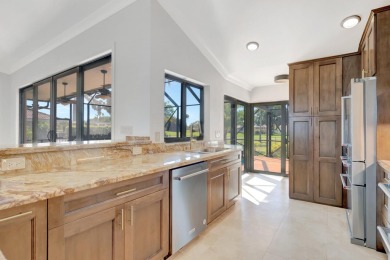 Nestled in the heart of Boca Woods Country Club, this home sits on Boca Woods Country Club in Florida - for sale on GolfHomes.com, golf home, golf lot