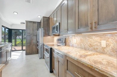 Nestled in the heart of Boca Woods Country Club, this home sits on Boca Woods Country Club in Florida - for sale on GolfHomes.com, golf home, golf lot