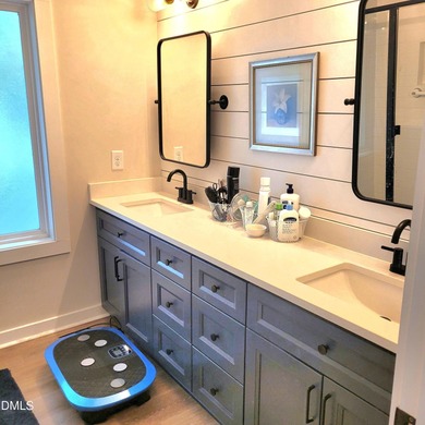 Waterfront home in beautiful Lake Royale with private dock on River Golf and Country Club at Lake Royale in North Carolina - for sale on GolfHomes.com, golf home, golf lot