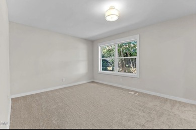 Waterfront home in beautiful Lake Royale with private dock on River Golf and Country Club at Lake Royale in North Carolina - for sale on GolfHomes.com, golf home, golf lot