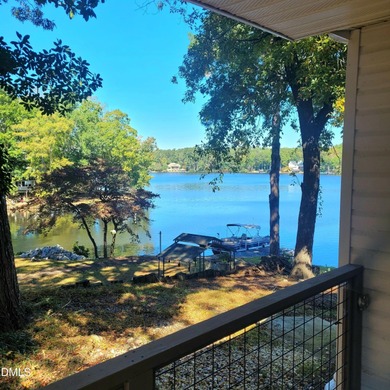 Waterfront home in beautiful Lake Royale with private dock on River Golf and Country Club at Lake Royale in North Carolina - for sale on GolfHomes.com, golf home, golf lot