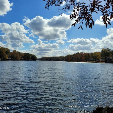 Waterfront home in beautiful Lake Royale with private dock on River Golf and Country Club at Lake Royale in North Carolina - for sale on GolfHomes.com, golf home, golf lot