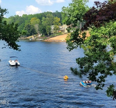 Waterfront home in beautiful Lake Royale with private dock on River Golf and Country Club at Lake Royale in North Carolina - for sale on GolfHomes.com, golf home, golf lot