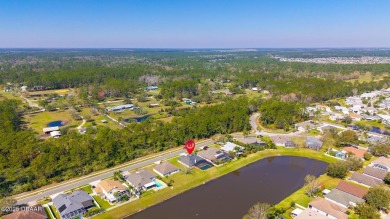 Relax in this quiet 4 bedroom pool home, with low-maintenance on Crane Lakes Golf and Country Club in Florida - for sale on GolfHomes.com, golf home, golf lot