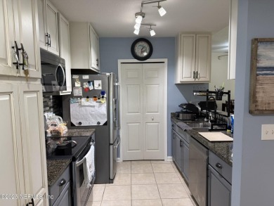 You will love this 1st floor end unit with lots of light and on St. Augustine Shores Golf Club in Florida - for sale on GolfHomes.com, golf home, golf lot