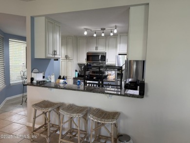You will love this 1st floor end unit with lots of light and on St. Augustine Shores Golf Club in Florida - for sale on GolfHomes.com, golf home, golf lot