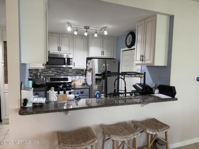 You will love this 1st floor end unit with lots of light and on St. Augustine Shores Golf Club in Florida - for sale on GolfHomes.com, golf home, golf lot