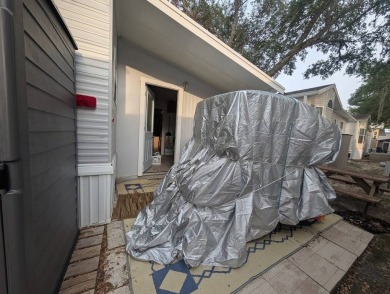 This Unit has a site built addition that includes a laundry or on Cane Garden Golf Course in Florida - for sale on GolfHomes.com, golf home, golf lot