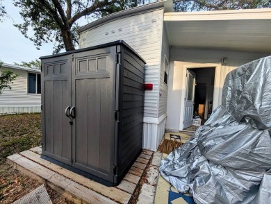 This Unit has a site built addition that includes a laundry or on Cane Garden Golf Course in Florida - for sale on GolfHomes.com, golf home, golf lot