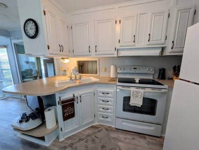 This Unit has a site built addition that includes a laundry or on Cane Garden Golf Course in Florida - for sale on GolfHomes.com, golf home, golf lot
