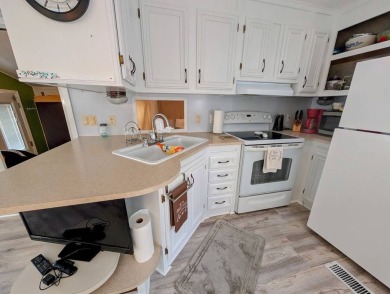 This Unit has a site built addition that includes a laundry or on Cane Garden Golf Course in Florida - for sale on GolfHomes.com, golf home, golf lot