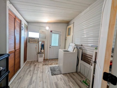 This Unit has a site built addition that includes a laundry or on Cane Garden Golf Course in Florida - for sale on GolfHomes.com, golf home, golf lot