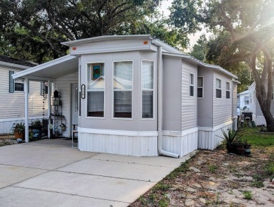 This Unit has a site built addition that includes a laundry or on Cane Garden Golf Course in Florida - for sale on GolfHomes.com, golf home, golf lot