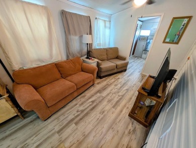 This Unit has a site built addition that includes a laundry or on Cane Garden Golf Course in Florida - for sale on GolfHomes.com, golf home, golf lot