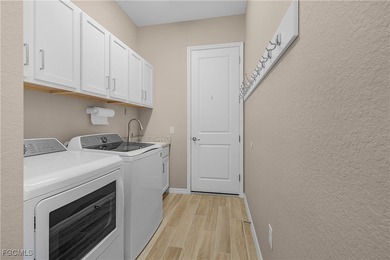 Welcome Home! Step into this beautifully designed Napoli Grande on Heritage Landing Golf  in Florida - for sale on GolfHomes.com, golf home, golf lot