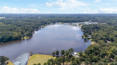 Nestled along the 3rd fairway of the Carolina Trace Lake Course on Carolina Trace Country Club in North Carolina - for sale on GolfHomes.com, golf home, golf lot