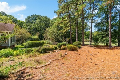 Nestled along the 3rd fairway of the Carolina Trace Lake Course on Carolina Trace Country Club in North Carolina - for sale on GolfHomes.com, golf home, golf lot