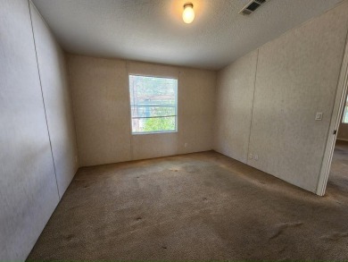 Make your new home in Lake Fairways, a well-maintained on Pine Lakes Country Club in Florida - for sale on GolfHomes.com, golf home, golf lot