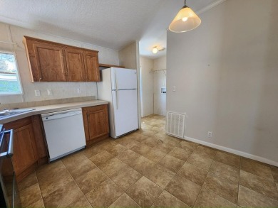 Make your new home in Lake Fairways, a well-maintained on Pine Lakes Country Club in Florida - for sale on GolfHomes.com, golf home, golf lot