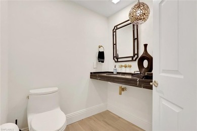 Welcome to this gracious, fully reimagined 2-bedroom plus 2 on Club at Pelican Bay Golf Course in Florida - for sale on GolfHomes.com, golf home, golf lot