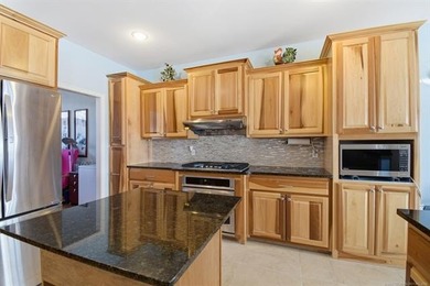 Spacious 5-bedroom, 3.5-bath, 2-story brick home on a large on Bailey Ranch Golf Club in Oklahoma - for sale on GolfHomes.com, golf home, golf lot