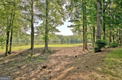 Lakefront Living in the Heart of Peachtree City! Enjoy the ease on Canongate At Flat Creek Club in Georgia - for sale on GolfHomes.com, golf home, golf lot