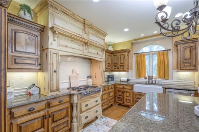 Welcome to this exceptional 1.5-story residence nestled in the on Tiffany Greens Golf Club in Missouri - for sale on GolfHomes.com, golf home, golf lot