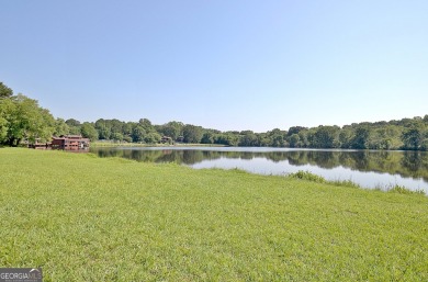 Lakefront Living in the Heart of Peachtree City! Enjoy the ease on Canongate At Flat Creek Club in Georgia - for sale on GolfHomes.com, golf home, golf lot
