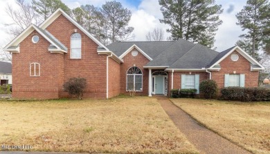 The perfect home to entertain  a crowd on a quiet street in the on Castlewoods Golf Club in Mississippi - for sale on GolfHomes.com, golf home, golf lot