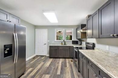 Nestled in the heart of Shellman Bluff, this two bedroom/two on Sapelo Hammock Golf Club in Georgia - for sale on GolfHomes.com, golf home, golf lot