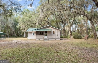 Nestled in the heart of Shellman Bluff, this two bedroom/two on Sapelo Hammock Golf Club in Georgia - for sale on GolfHomes.com, golf home, golf lot