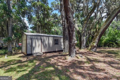 Nestled in the heart of Shellman Bluff, this two bedroom/two on Sapelo Hammock Golf Club in Georgia - for sale on GolfHomes.com, golf home, golf lot