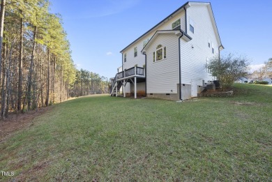 Nestled in the prestigious Hasentree Community this exceptional on Hasentree Club in North Carolina - for sale on GolfHomes.com, golf home, golf lot