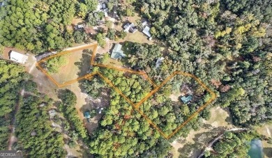 Nestled in the heart of Shellman Bluff, this two bedroom/two on Sapelo Hammock Golf Club in Georgia - for sale on GolfHomes.com, golf home, golf lot