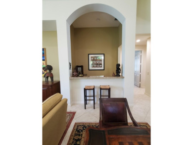 This beautifully designed single-story home is 4 BR plus office on BallenIsles Golf and Country Club in Florida - for sale on GolfHomes.com, golf home, golf lot