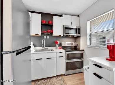 Remodeled 2 bedroom, 2 bath second floor condo offering 910 on Daytona Beach Golf Club in Florida - for sale on GolfHomes.com, golf home, golf lot