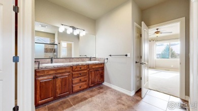 Experience the best of both worlds: watch golfers tee off across on Highland Meadows Golf Course in Colorado - for sale on GolfHomes.com, golf home, golf lot