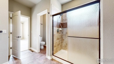 Experience the best of both worlds: watch golfers tee off across on Highland Meadows Golf Course in Colorado - for sale on GolfHomes.com, golf home, golf lot