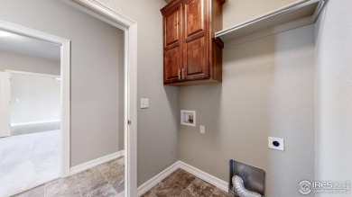 Experience the best of both worlds: watch golfers tee off across on Highland Meadows Golf Course in Colorado - for sale on GolfHomes.com, golf home, golf lot