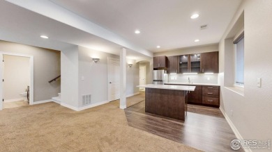 Experience the best of both worlds: watch golfers tee off across on Highland Meadows Golf Course in Colorado - for sale on GolfHomes.com, golf home, golf lot
