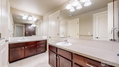 Experience the best of both worlds: watch golfers tee off across on Highland Meadows Golf Course in Colorado - for sale on GolfHomes.com, golf home, golf lot