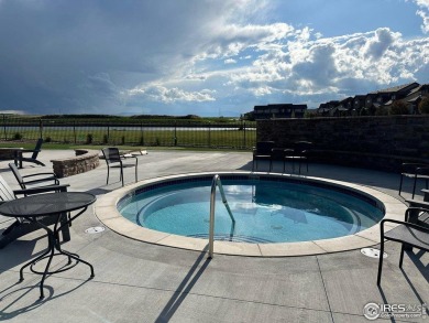 Experience the best of both worlds: watch golfers tee off across on Highland Meadows Golf Course in Colorado - for sale on GolfHomes.com, golf home, golf lot