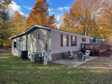 Enjoy year round living from this 2 bedroom- 2 bath well on McCauslin Brook Golf and Country Club in Wisconsin - for sale on GolfHomes.com, golf home, golf lot