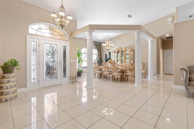 Welcome to a luxurious and elegant 4-bedroom, 3.5-bathroom on The Grand Club Cypress Course in Florida - for sale on GolfHomes.com, golf home, golf lot
