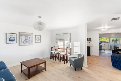 Get ready to fall in love with this absolutely charming and on Venice East Golf Club in Florida - for sale on GolfHomes.com, golf home, golf lot