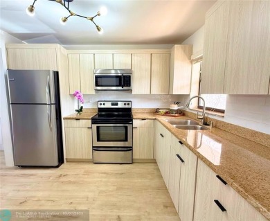 NEW BATHS, TILE  WATERPROOF FLOORING, UPDATED KITCHEN, NEW WATER on Sunrise Lakes Phase III in Florida - for sale on GolfHomes.com, golf home, golf lot