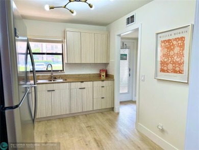 NEW BATHS, TILE  WATERPROOF FLOORING, UPDATED KITCHEN, NEW WATER on Sunrise Lakes Phase III in Florida - for sale on GolfHomes.com, golf home, golf lot