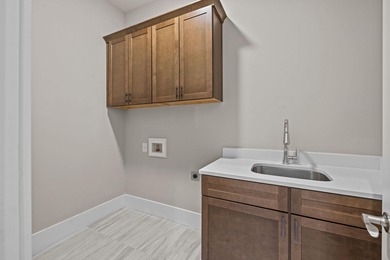 Embark on an unparalleled lifestyle in this exquisite golf-front on Harbor Club Golf and Country Club in Georgia - for sale on GolfHomes.com, golf home, golf lot