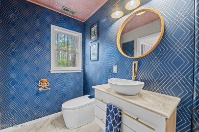 Welcome to 806 Wind Way - a hidden gem nestled in the gated on Harbour Point Golf Club in North Carolina - for sale on GolfHomes.com, golf home, golf lot